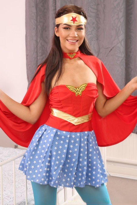 Cute wonder woman Zoey King strips and shows tiny tits in hot pantyhose