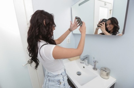 Hot teen Nicki Ortega takes selfies in the bathroom before stripping