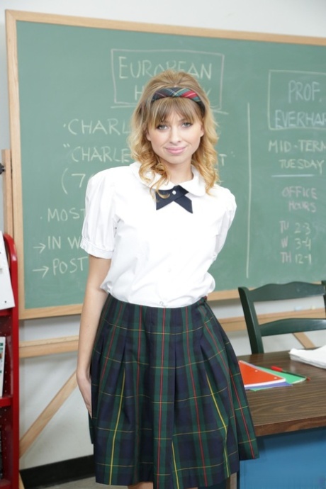 American brunette schoolgirl Molly Bennett strips naked in her classroom