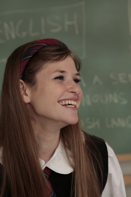 Flighty schoolgirl Lara Brookes stripping her sexy uniform off in classroom