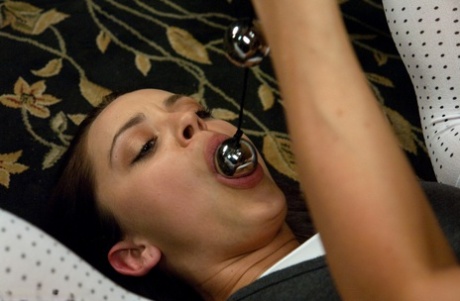 Brunette student Liza Del Sierra is subjected to lezdom anal play by a teacher