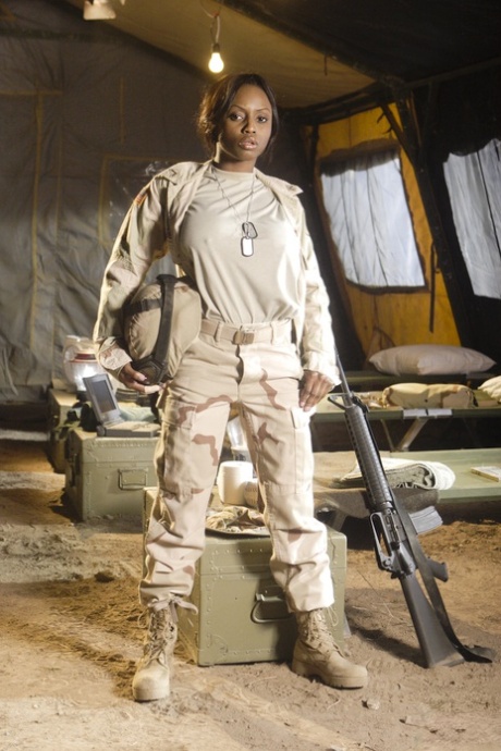 Ebony military girl Jada Fire doffs her uniform & shows off her exotic tits