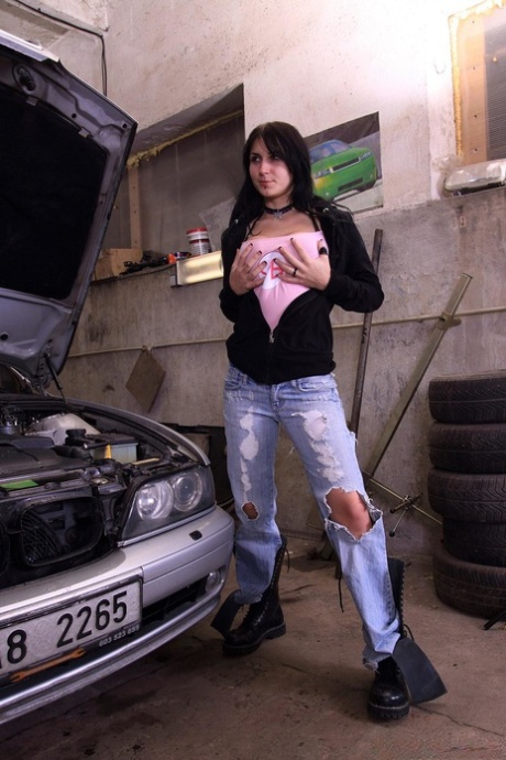 Brunette teen Roxy D gets screwed at the garage & has her big tits spunked