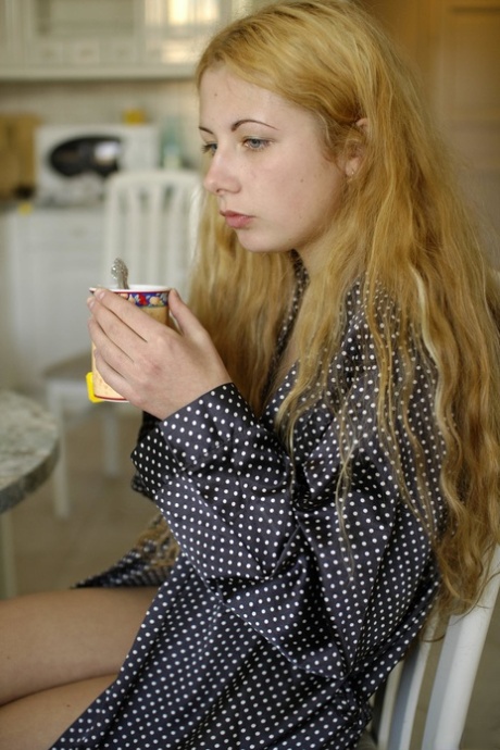 Blonde teen Sasha A sitting in the chair showing her tiny boobs & hairy pussy