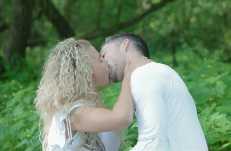 Curly-haired blonde MILF Angel Diamonds having sex with her new lover outdoors