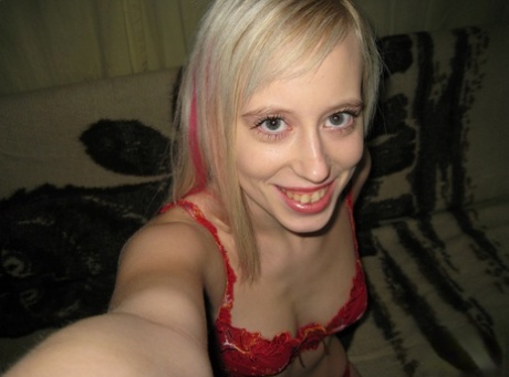 Delightful blonde teen Teena spreads her shaved clam to take selfies