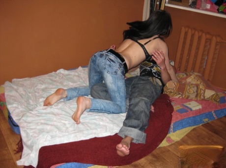 Amateur teen Lara doffs her jeans and climbs on a stiff boner on a bed