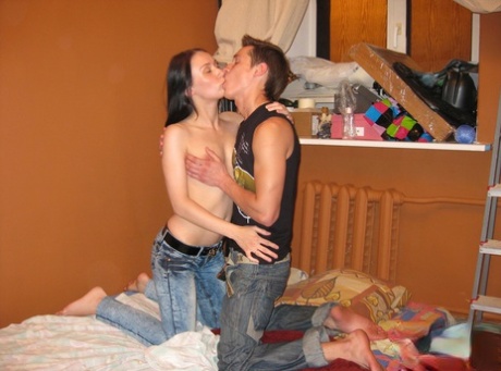 Amateur teen Lara doffs her jeans and climbs on a stiff boner on a bed