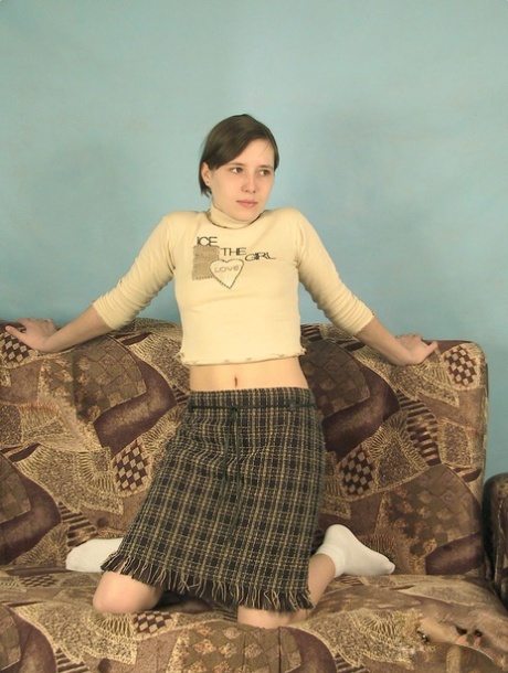 Amateur teen Valia removes her plaid skirt and touches her bald vagina