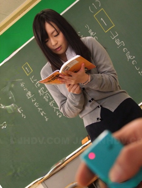 Asian teacher Nozomi Hazuki gets her twat toyed in the classroom