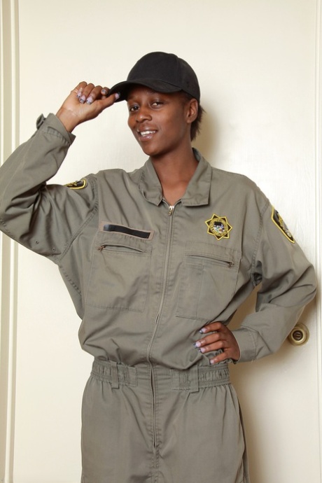 Amateur ebony Entice shows her nice boobs after stripping her uniform