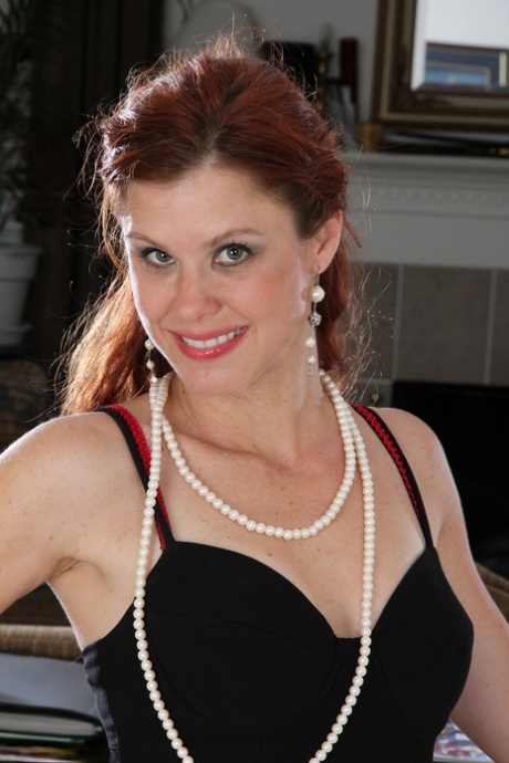 Mature Jessica Adams peels her gown, spreads her legs & teases with her pearls