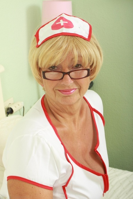 Naughty mature nurse Samantha T shows her saggy tits & her shaved pussy