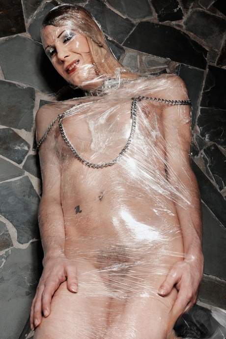 Submissive shemale wrapped in plastic Isabella Di Avila gets fucked doggystyle