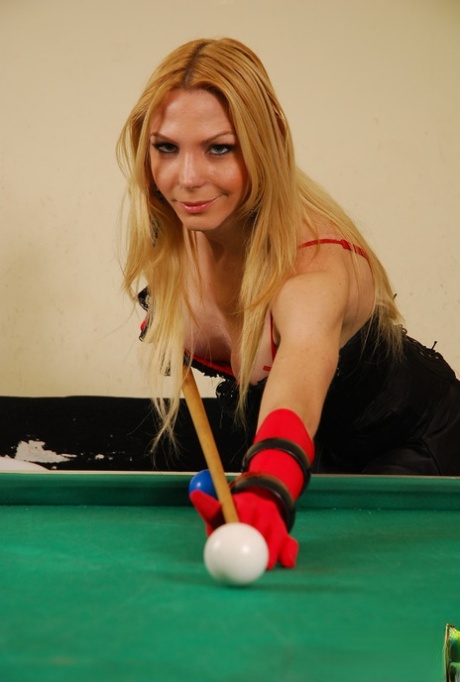 Hot shemale Laviny Albuquerque exposes her big tits & dick on a billiard table