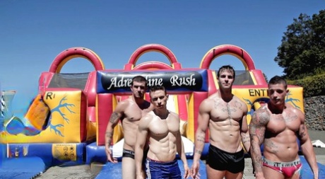 Muscular dudes engaging in an intense gay orgy at the water park