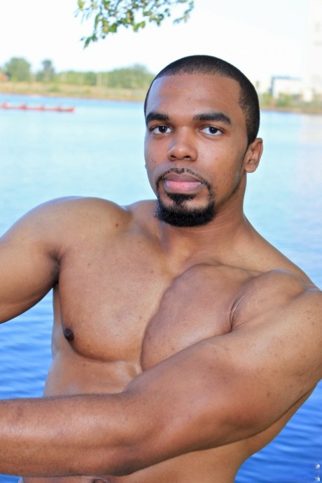 Muscular hunk Boxer shows his big black prick and masturbates until he cums