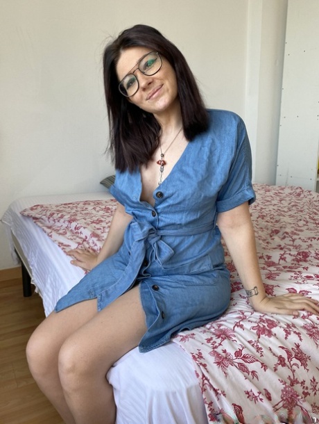 Brunette amateur Meraki removes her denim dress and flaunts her fakes