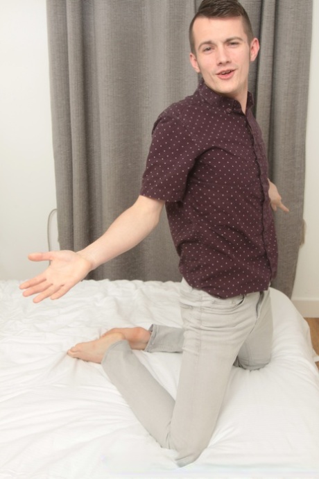 Skinny twink shows off his hot ass in a sexy striptease on his bed