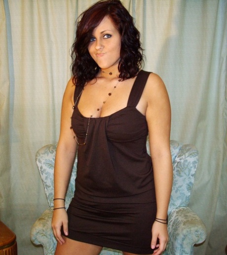 Curly haired amateur in a cute black dress exposes her amazing big boobs