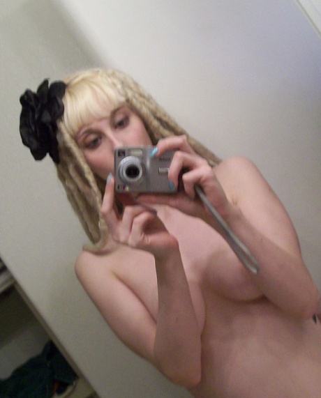 Blonde amateur teen takes hot naked selfies in the bathroom mirror