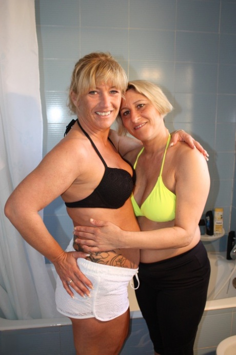 German MILF Teresa Lynn showers with her GF before massaging a fat naked man