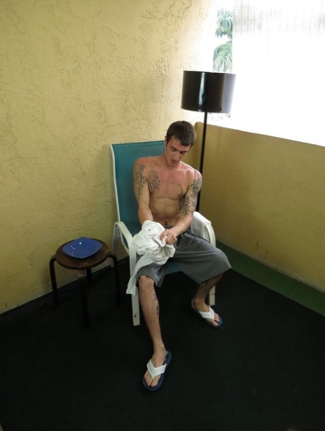 Kinky gay with tattoos Jake Riley toys his asshole while jacking off