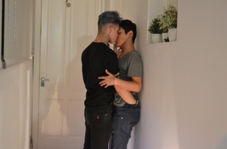 Blue-haired twink fucks his brunette roommate in the mouth and ass