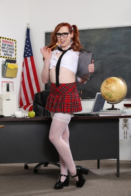 Redheaded shemale schoolgirl Shiri Allwood gets analized by her teacher