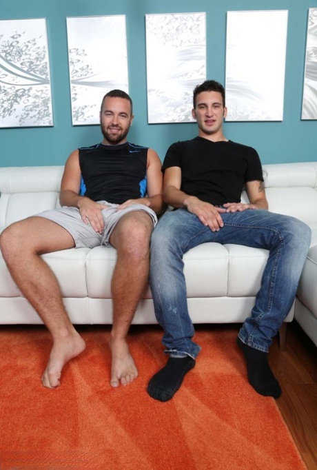 Sexy gay dudes Noah Riley and Lambert masturbate before oral sex on a couch