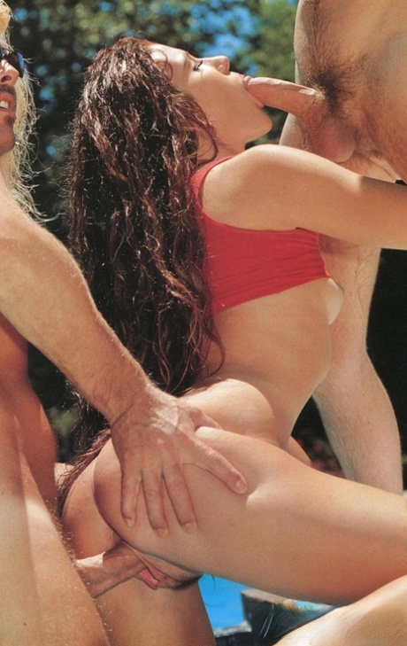 Sexy redhead takes two stiff boners at once in a vintage outdoor scene