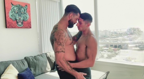 Tattooed bearded gay hunk Alpha Wolfe fucks hot Jim Fit in the mouth and ass