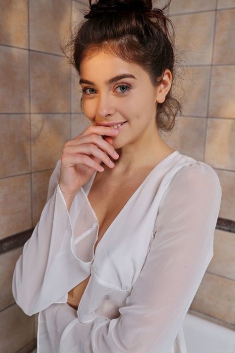 Glamorous Ukrainian teen Foxy Alissa shows off her big ass & rubs her twat