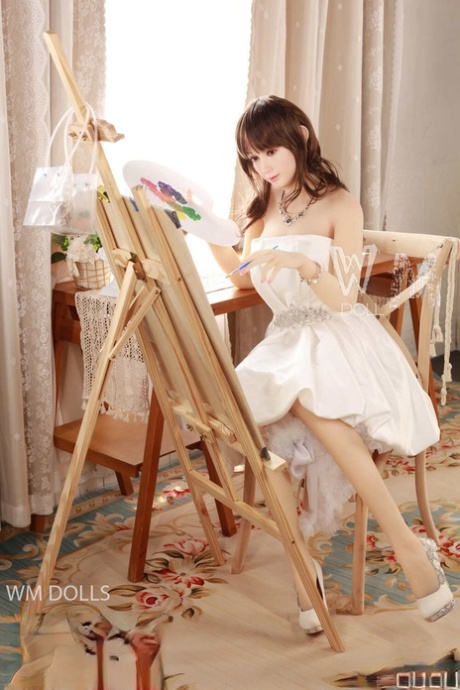 Adorable artist sex doll Myrtille posing in her elegant white dress