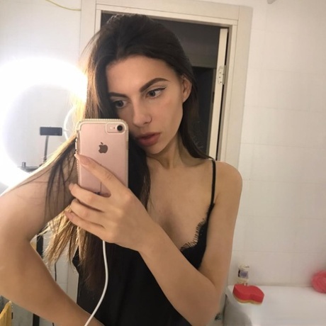 Amateur teen shows her cute suckable tits in her bedroom mirror