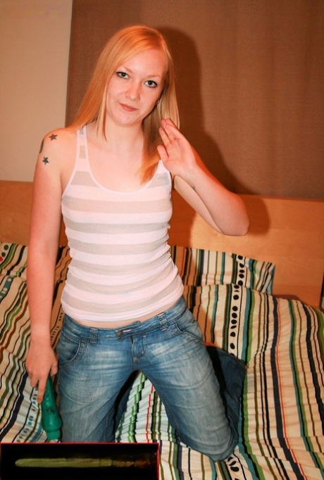 All-natural blonde in a shirt & jeans Bhala Sada posing with her toy