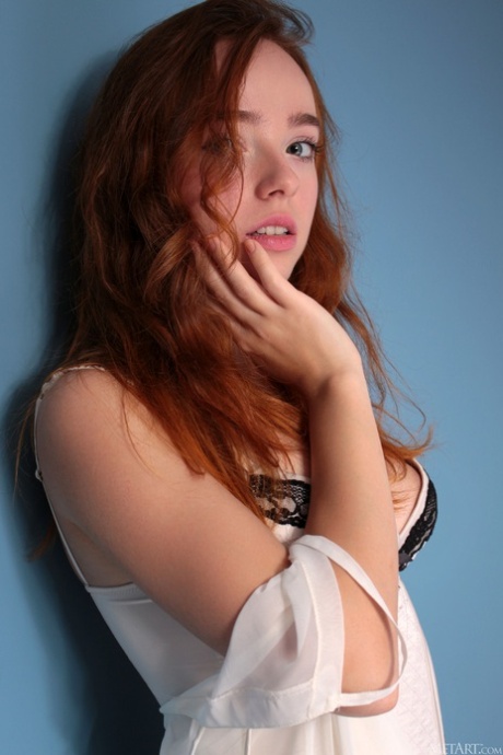 Redheaded teen Rinna Ly unveils her natural boobs and poses in stockings