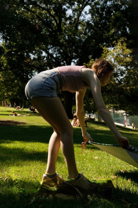 Amateur babe Myra Glasford posing topless and sunbathing at the park