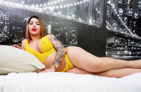 Inked shemale Ashley Helena flaunts her big tits, ass and meat pole