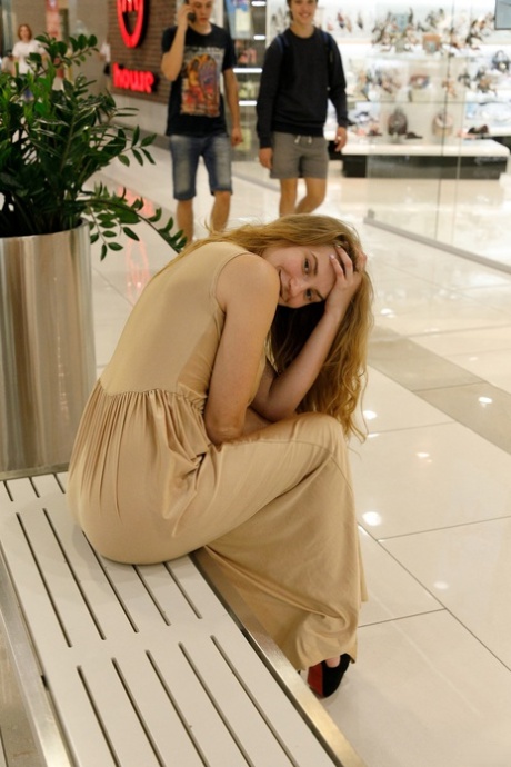 Ukrainian babe Regan Budimir flashes her big tit while posing at the mall