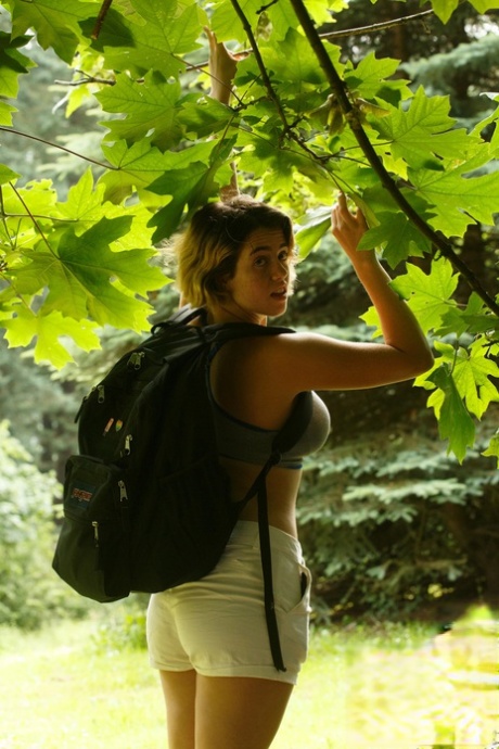 Alluring babe Peach Kennedy teases with her big tits in a sexy hiking outfit