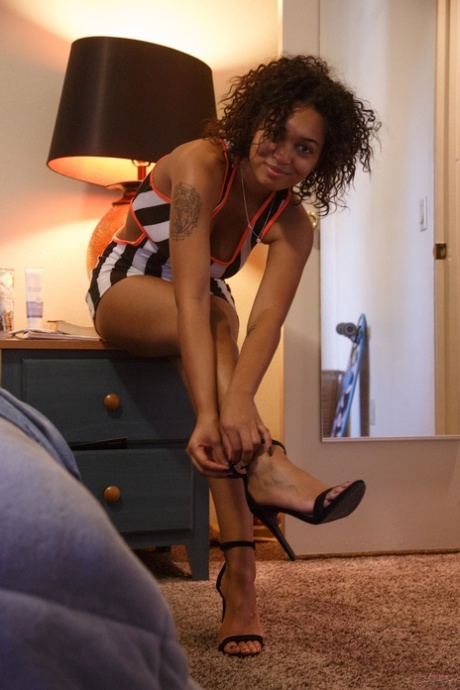 Skinny ebony teen Noelle Monique strips her tight dress & massages her boobs