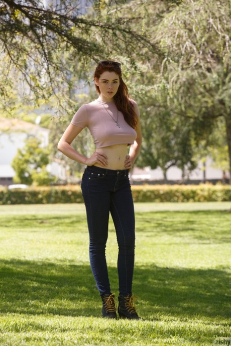 Redheaded freckled babe Sabrina Lynn flaunts her underboobs outdoors