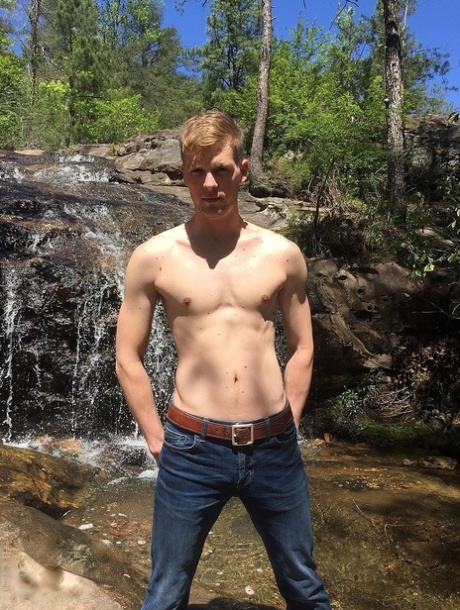Bored gay hottie Ty Thomas strips in nature and shows his lean body & big dick