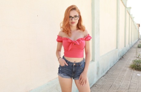 Glasses-clad redhead Mina Von D sucks & humps a huge white dick in public