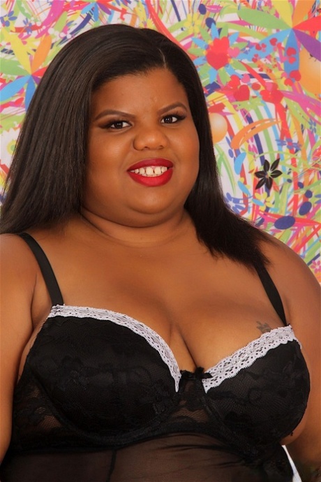 Ebony SSBBW Peaches Love enjoys interracial sex with her lover on the sofa