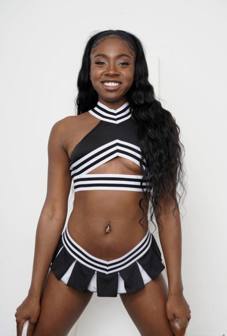 Naughty ebony cheerleader Amari Anne shows off her big ass & her shaved pussy