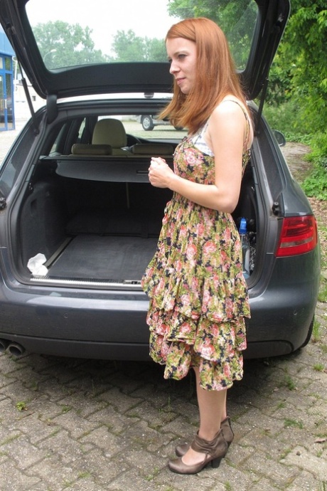 Redheaded German Meine Fotze strips and masturbates in the car in public