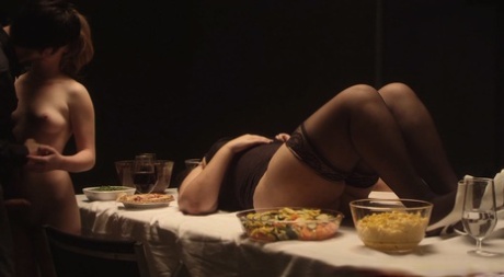 Chubby babe lies on the dinner table as her friends have sex in a kinky orgy