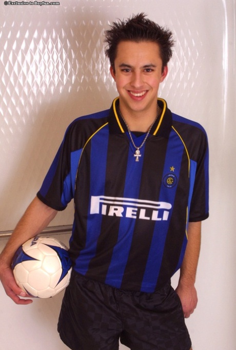 Horny gay Kris doffs his Inter jersey and masturbates hard in a solo